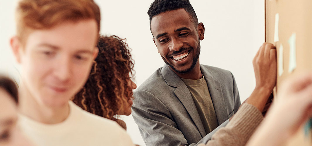 employees of various races are laughing and talking