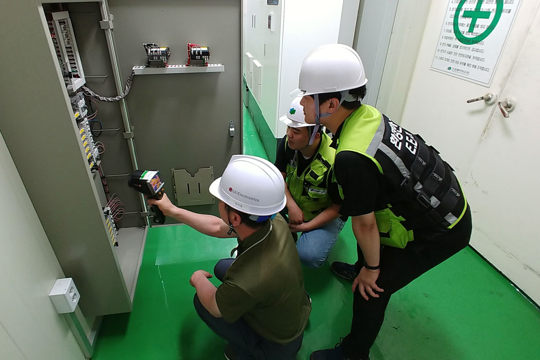 image of 3 engineers testing an electrical equipment for safety check