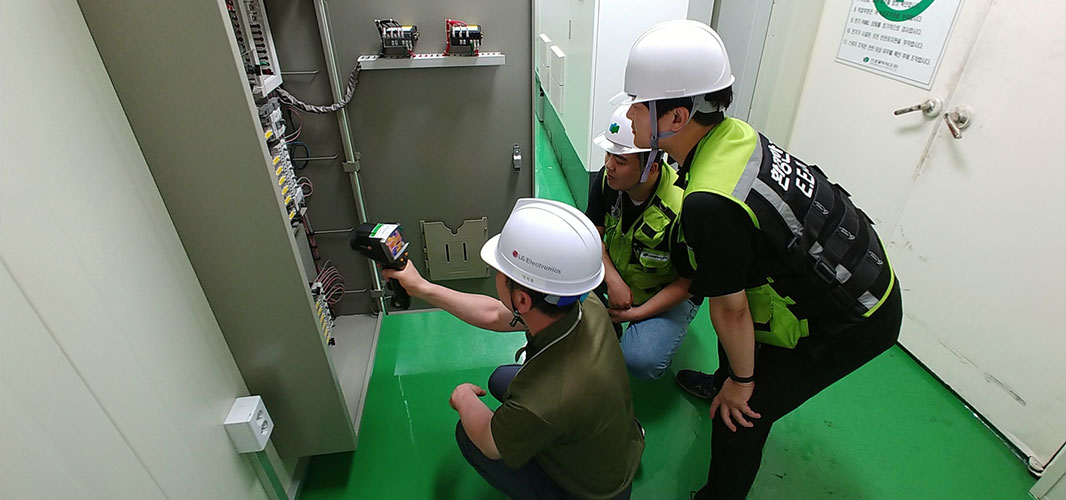 image of 3 engineers testing an electrical equipment for safety check