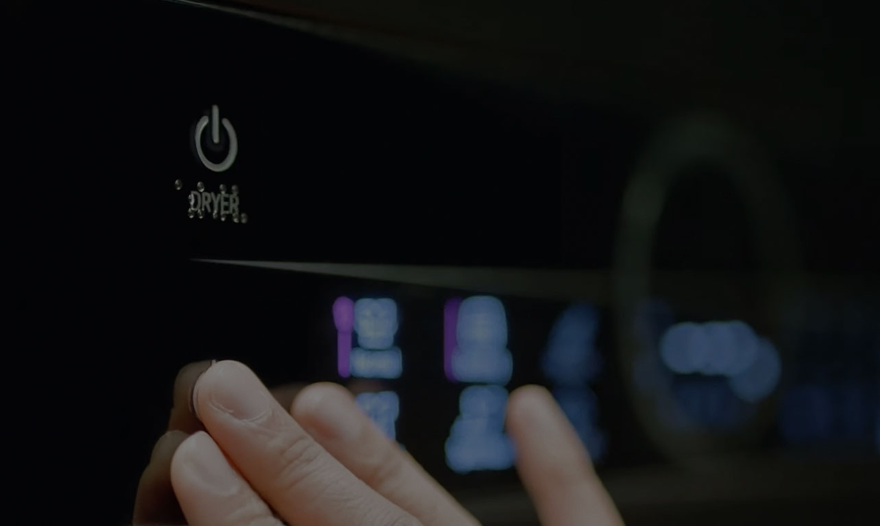 image of reading braille and control button on the washing machine control panel