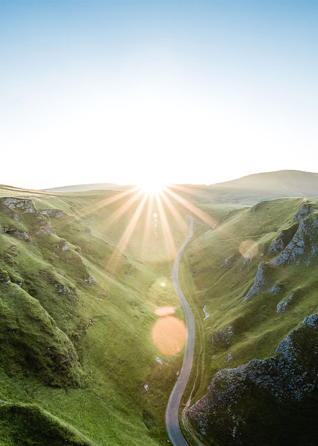 image of sun sets right at the top of the valley