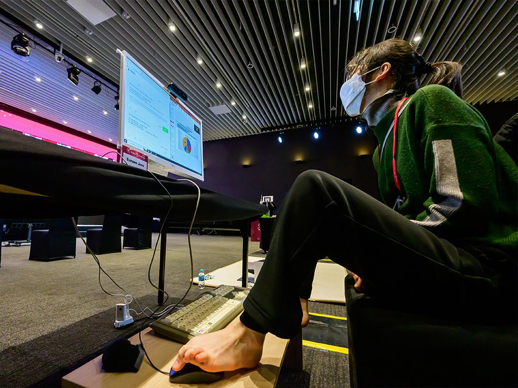 a participant controlling a footmouse in 2022 LG Electronics Global IT Challenge for youth with disabilities