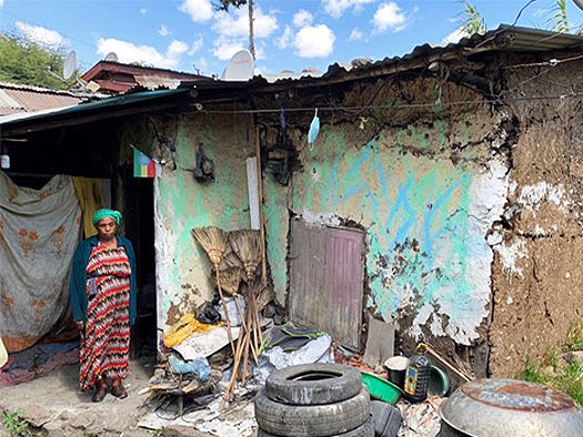 an Ethiopian house with cracked mud walls before being rebuilt through LG’s Life’s Good: Hope Village campaign